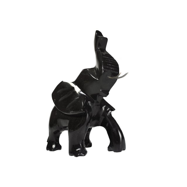 This vintage black onyx elephant figurine is a stunning example of fine craftsmanship and a symbol of good luck. The...