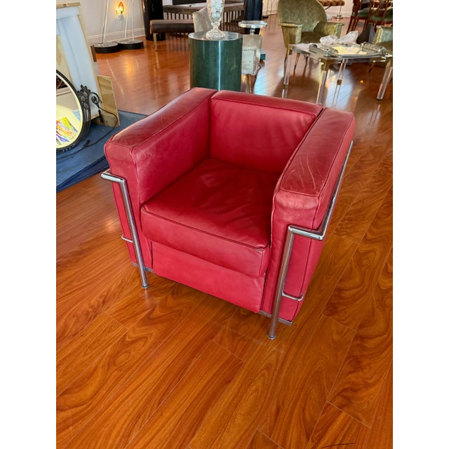 Stylish chrome and red leather club chair in the style of Le Corbusier.