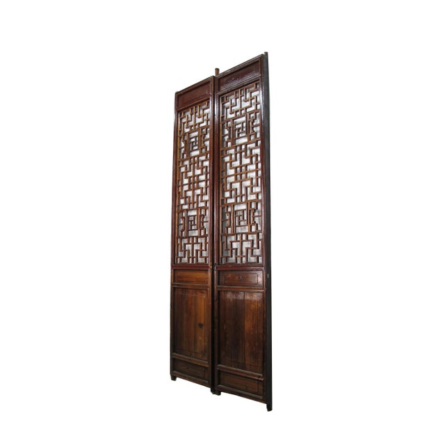 This pair antique Chinese screen door panels showcase hand made intricately designed lattice patterns. Each lattice panel...