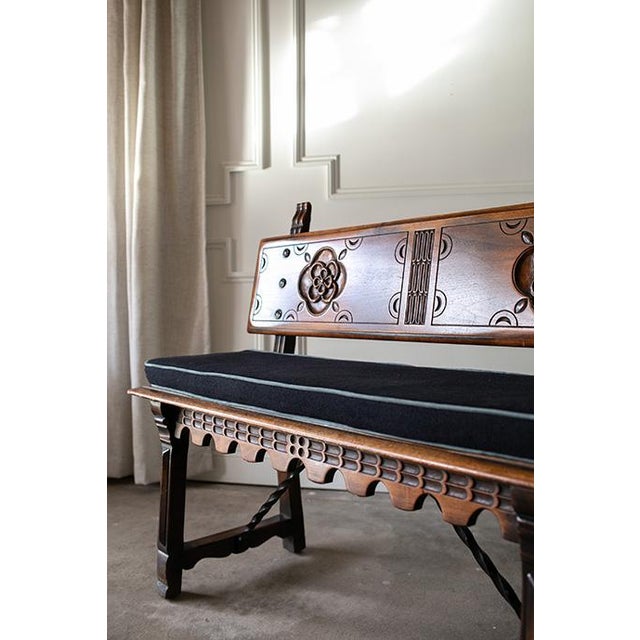 A magnificent early 20th-century Spanish Revival hall bench by the renowned Kittinger Furniture Company of Buffalo, NY. A...