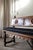 A magnificent early 20th-century Spanish Revival hall bench by the renowned Kittinger Furniture Company of Buffalo, NY. A...