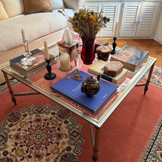 Elegant and timeless Maison Janse coffee table features a 36” square beveled glass top. The sleek steel base is accented...