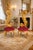 Introduce bold Italian elegance into your interior with this striking pair of Rococo Revival side chairs, crafted in the...