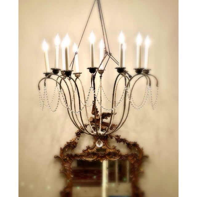 Signed Niermann Weeks 12-light chandelier in an elegant Italian neoclassical style, inspired by 18th century European...