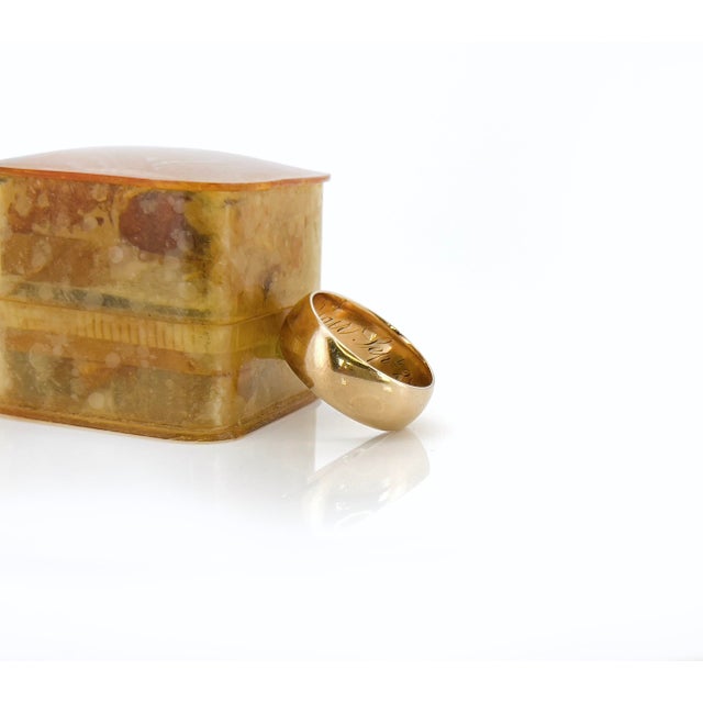 About This Ring Step into the world of sentimental jewelry with this classic Victorian gold band featuring a rich patina....