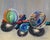 Light Diversions 3 by Wendy Carney | Oil on Linen Panel Still life of marbles and crayons For Sale