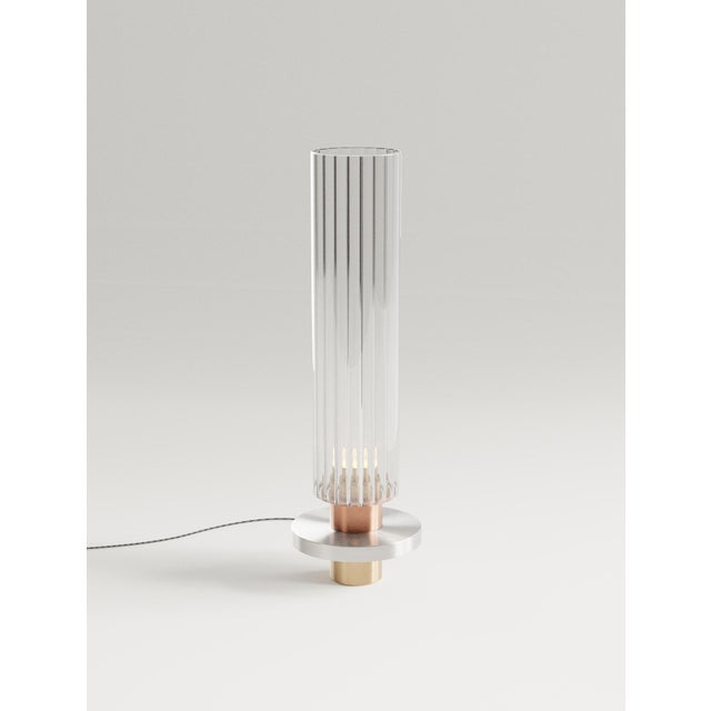 Liban table lamp in brass, aluminum & fluted glass by studio marine breynaert. Dimensions: ø 16 × h 55 cm. Materials:...