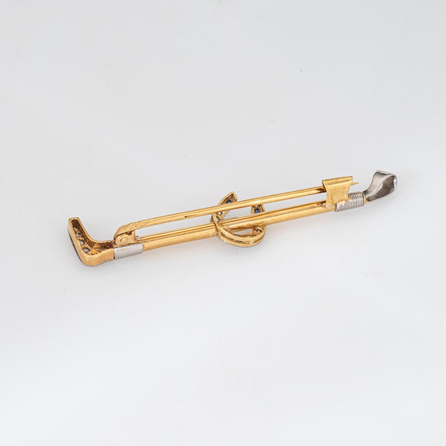 Finely detailed antique Portuguese horseshoe riding crop brooch crafted in 19k yellow gold and platinum (circa 1887 to...