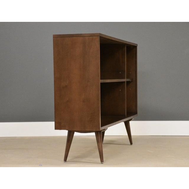 A mid century modern solid maple bookcase with adjustable shelves designed by Paul McCobb for Winchendon’s Planner Group...