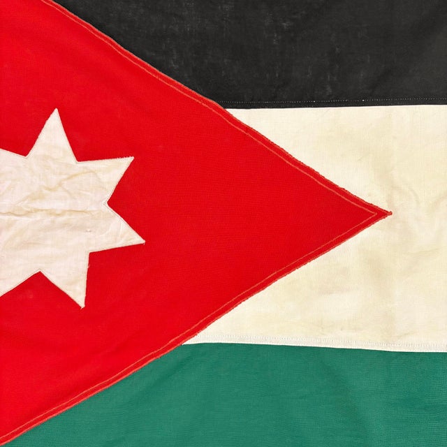 This vintage Jordanian flag is made from a cotton or similar cloth, with fully sewn design visible on both sides. Please...