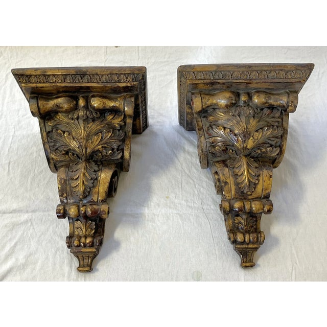 Awesome pair of monumental wall brackets. These vintage pieces are made of plaster and adorned with scroll and acanthus...
