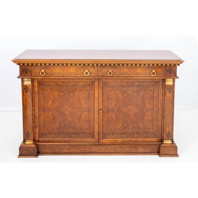 Empire Style Walnut Buffet, the rectangular top on two frieze drawers with four brass ring handles above two door cabinet...