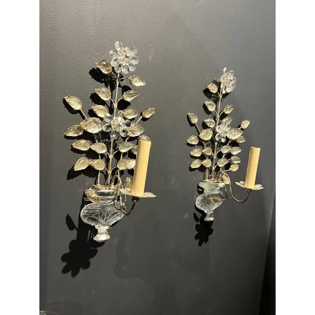 A Pair of silver metal sconces with glass leaves and body. Made in the 1930s.