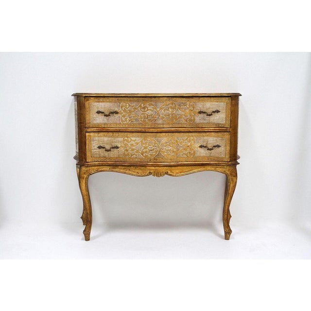 Eyecatching 18th century style gilt Venetian serpentine commode/ chest of drawers from the era around 1940/50. An amazing...