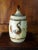 Large lidded jar with naive bird and sunflower design. This piece will bring the spirit of the 50s style back into any...