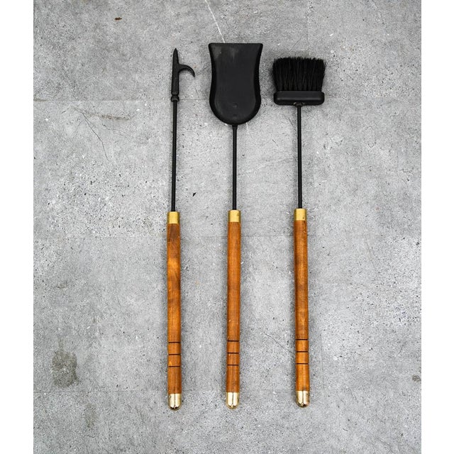 Set of American designed fireplace tools made of up wood, brass and Iron . Well made Set. Fully intact and functional.