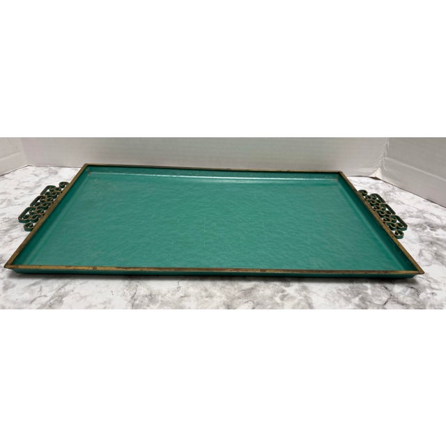 Vintage rectangular turquoise and gold metal decor tray with ornate swirled side handles. Perfect for table, credenza or...