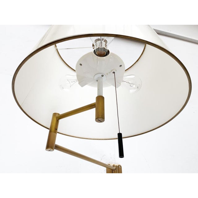 Flexible wall lamp from Swisslamps in brass. A classic design of high flexibility and materiality. The name refers to the...