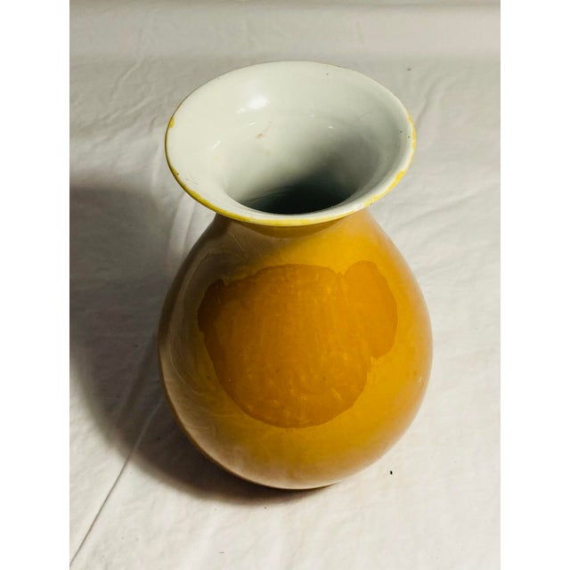 Small high gloss glaze in burnt orange on Chinese plum shape porcelain vase gloss cream interior