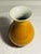 Small high gloss glaze in burnt orange on Chinese plum shape porcelain vase gloss cream interior