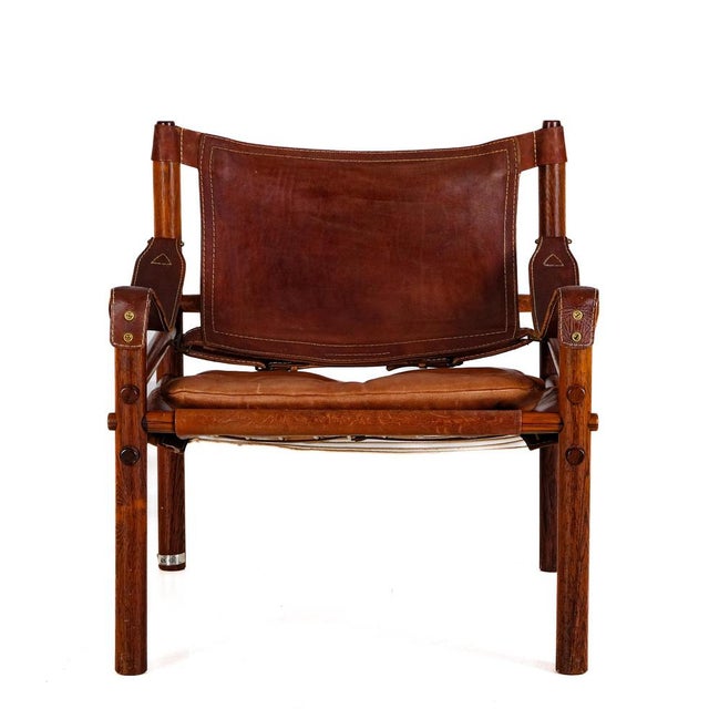 Safari chair model Sirocco in good condition. Original cognac leather. Designed by Arne Norell, produced by Arne Norell AB...