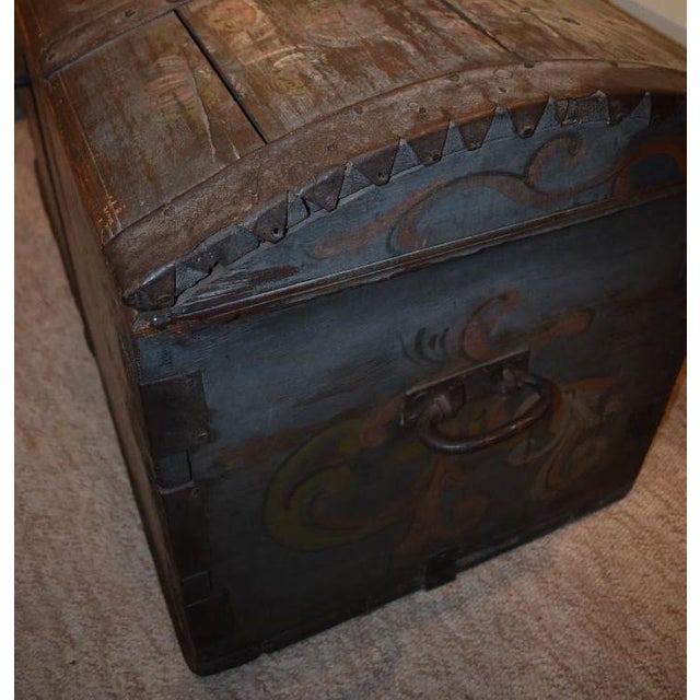 An amazing early immigrant trunk with what I believe is Telemark type rosemaling at front, top, and sides, dated 1838. The...