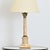 A French Neoclassical table lamp from the 19th century, carved from onyx as a column adorned with cast brass fittings at...