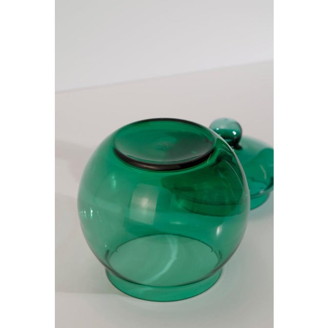 A hand-blown Empoli vetro verde glass apothecary jar with lid, crafted in Empoli, Italy during the 1960s. Executed in the...