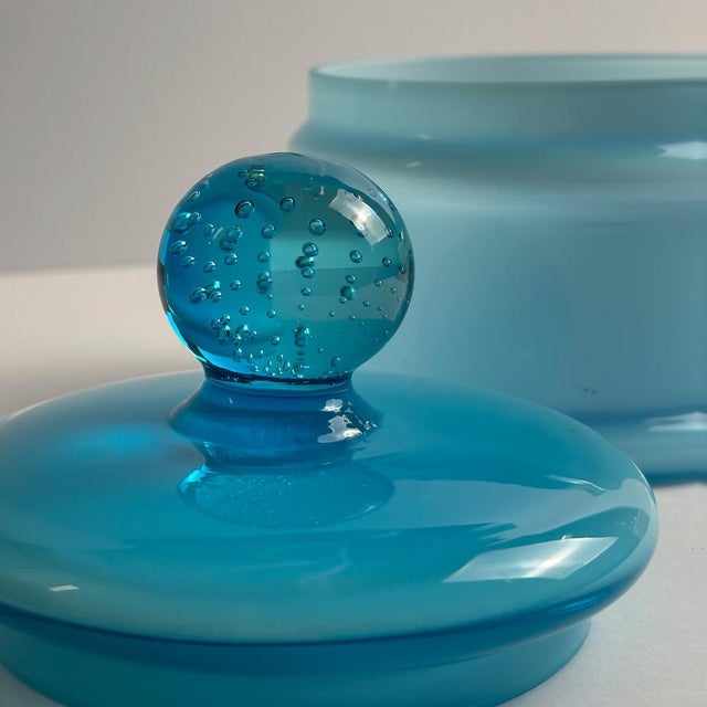 A cased pale blue empoli glass apothecary jar, by carlo moretti. Handcrafted in the empoli region of italy during the...