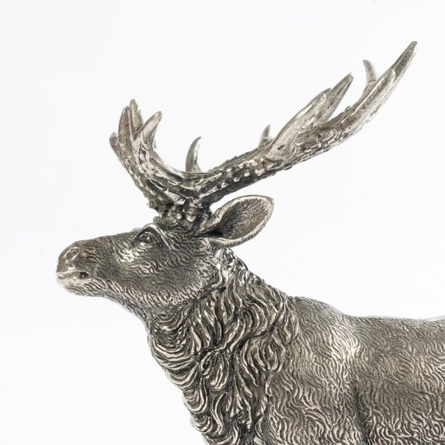 Pair of silver-plated stags with beautiful details. These will make a great addition to any room in your home.
