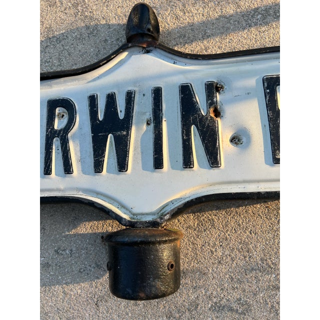 Vintage Metal Embossed Street Sign “Merwin Road” . Double sided metal road sign. Merwin Road in case in black rod iron....