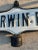 Vintage Metal Embossed Street Sign “Merwin Road” . Double sided metal road sign. Merwin Road in case in black rod iron....