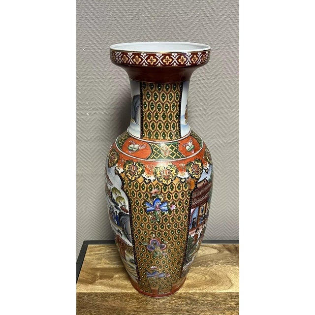 Asia, 20th century: large porcelain vase decorated with lively scenes within frames, H63 x 28 cm