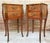 A pair of Antique French Louis XV Marquetry marble top nightstands. Subtle contours and scroll shapes are evident in the...