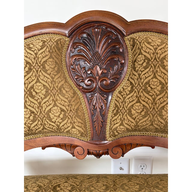 Beautiful matched Victorian walnut parlor suite consisting of a carved settee and a platform rocker, dating from...