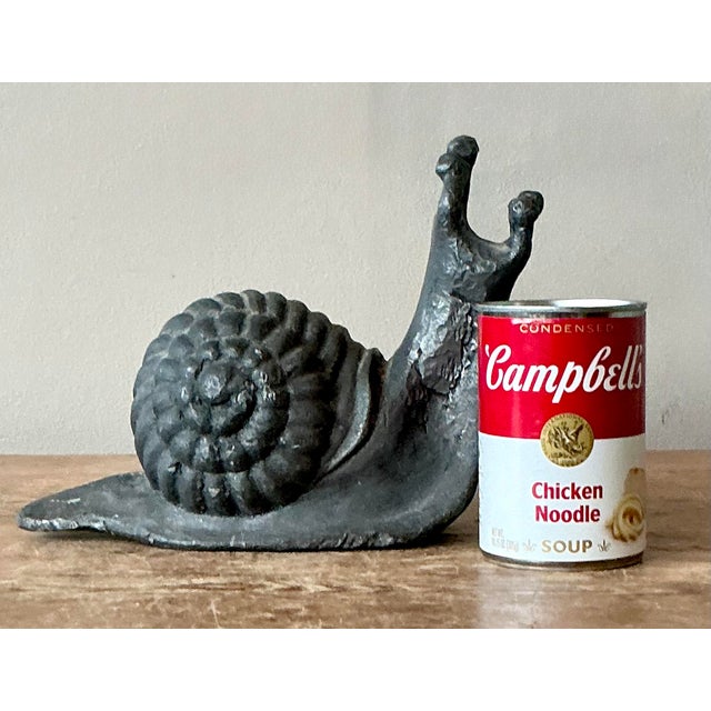 Infuse your home or garden with a touch of woodland whimsy with this charming vintage snail sculpture. Expertly cast from...