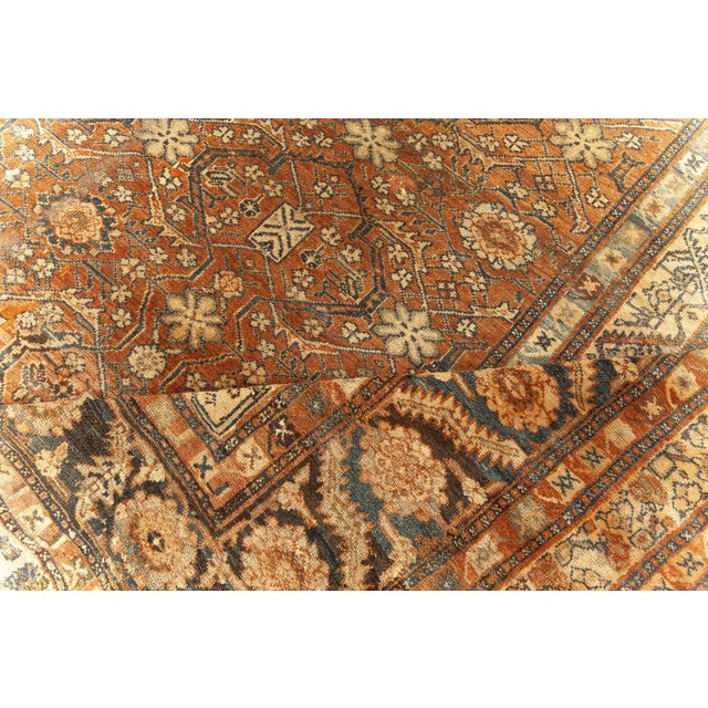A magnificent testament to the artistry of early 20th-century Persian weaving, this oversized antique Bibikabad rug,...