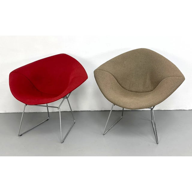 Authentic pair of Harry Bertoia Diamond Lounge Chairs, manufactured by Knoll and identified by the Knoll manufacturer's...