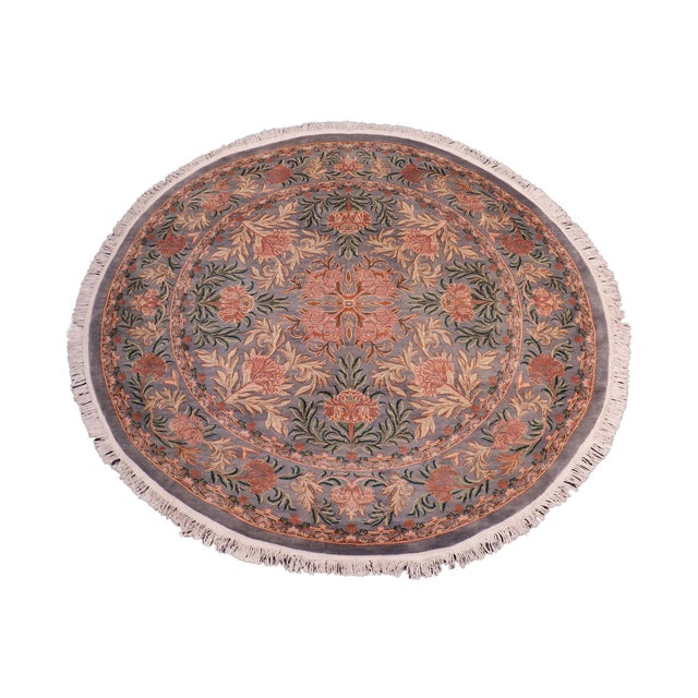 This hand‑knotted Pak Persian round rug showcases the finest expression of traditional Persian artistry. Each piece is...