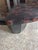 Elegant modern center table having sculptural ebonized wood base and organic tessellated top with checkerboard pattern...