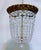 Vintage bronze basket chandelier with 30% leaded graduated octagon crystals. Rewired and restores and it has 3 candelabra...