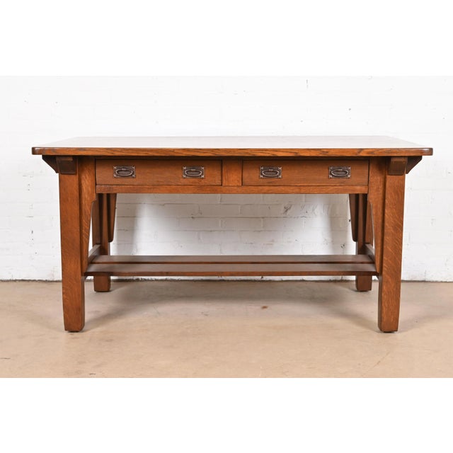 An exceptional antique Mission or Arts & Crafts writing desk or library table By Stickley Brothers USA, Circa 1900 Solid...
