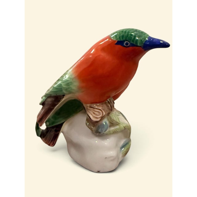 A delightful Pair of Hand-Painted Herend Porcelain Birds, exquisitely modeled and richly decorated in vibrant coral,...
