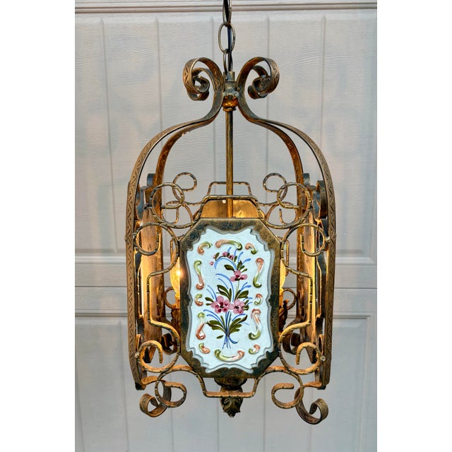 The four porcelain plaques on this vintage lantern are so pretty and very charming. Dainty flowers and scrolls add so much...