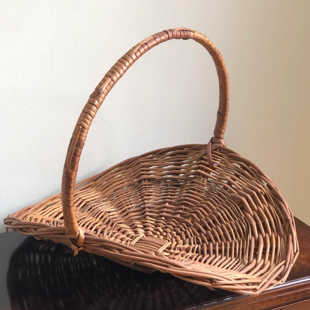 A gorgeous vintage flower gathering basket from Portugal. This mid-20th century basket features a rich and warm patina and...
