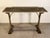 This antique French iron and marble garden console table, dating to the early 1900s and sourced in France, beautifully...