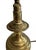 A striking vintage table lamp featuring an oversized lyre-form brass frame surrounding a frosted glass bell shade. The...