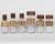 A set of six 19th century French glass apothecary jars or bottles with red painted tin lids. Hand-blown clear glass....
