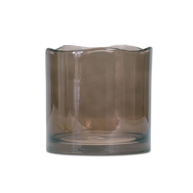 Add a touch of elegance to any space with this Decorative Wavy Glass Vase. Standing 6 inches tall and featuring a unique...