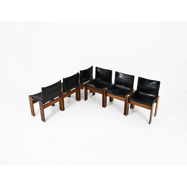 Set of 6 black leather and wood chairs designed by Afra & Tobia Scarpa. Model: Monk. Seat height: 43 cm. Signs of wear...